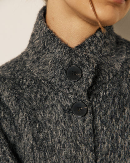 Gray women's Vivien woven jacket by Hartford Women's, featuring textured fabric and tailored fit, displayed on a hanger.