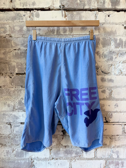 Women's Freecity matte satin back pocket short in periwinkle plant powder fabric, featuring a stylish relaxed fit.