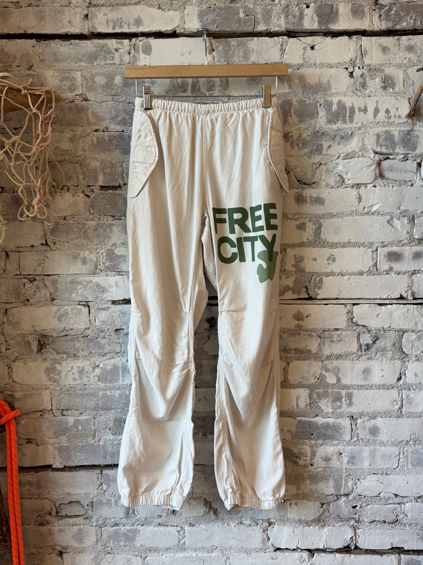 Women's Freecity Airjump Pant in Laundry Green with matte and satin finish, featuring a flap and snap-free design.