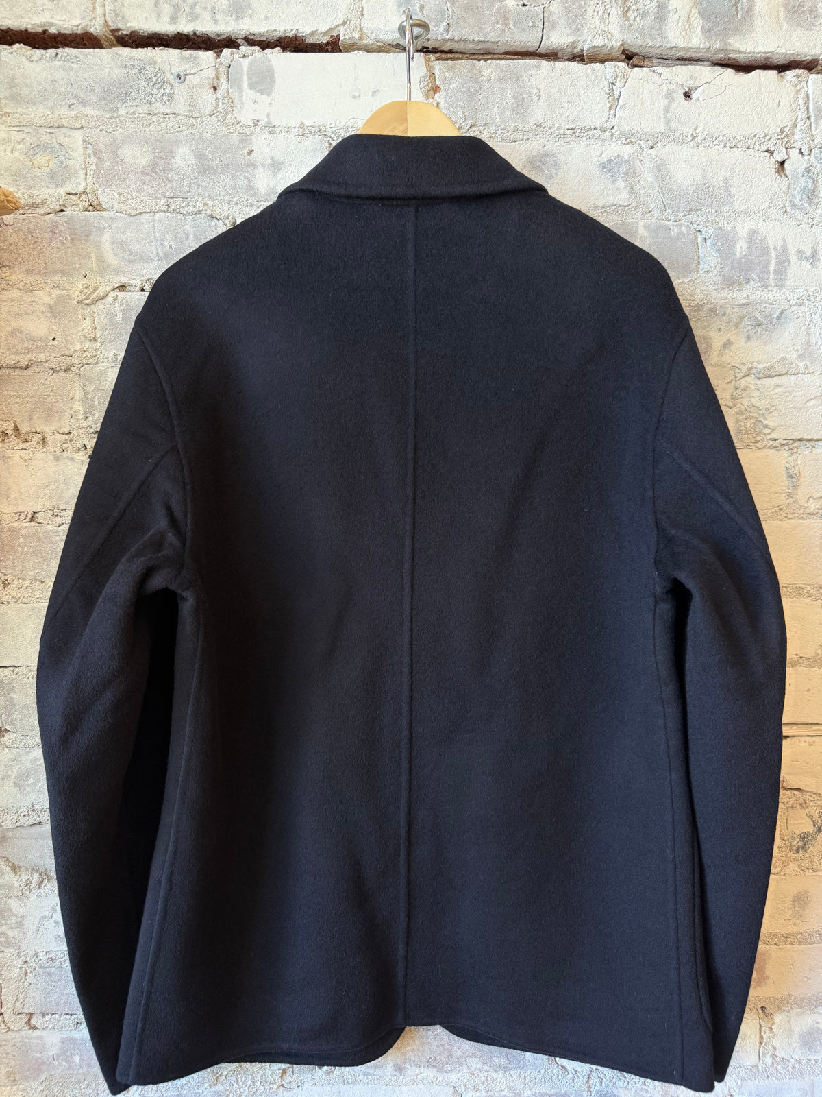 Hartford Men's Jojo Woven Jacket in navy, showing the textured fabric, collar, and front button closure.