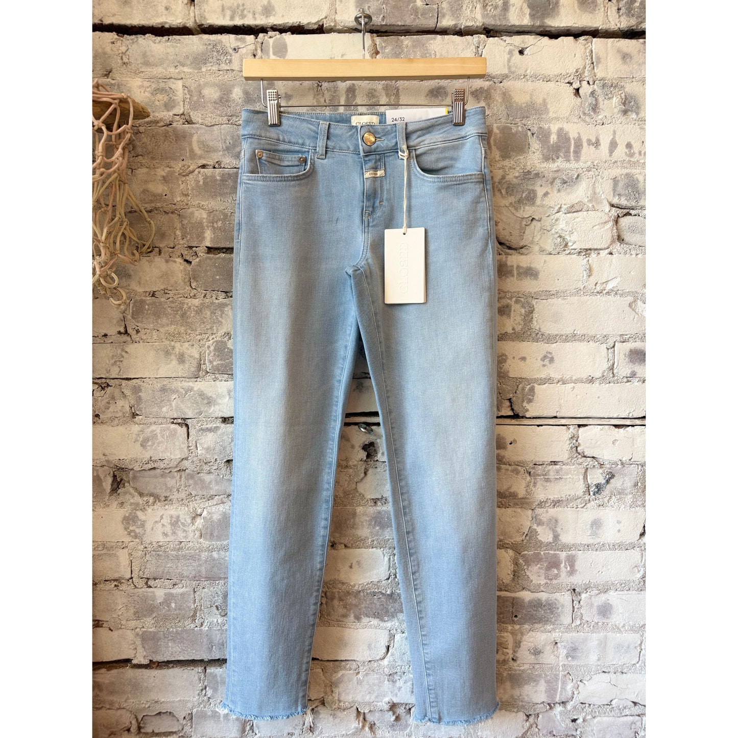 Women's Baker Slim Jean by Closed in light blue denim, showing a close-up of the fitted, slim-leg style with classic five-pocket design.