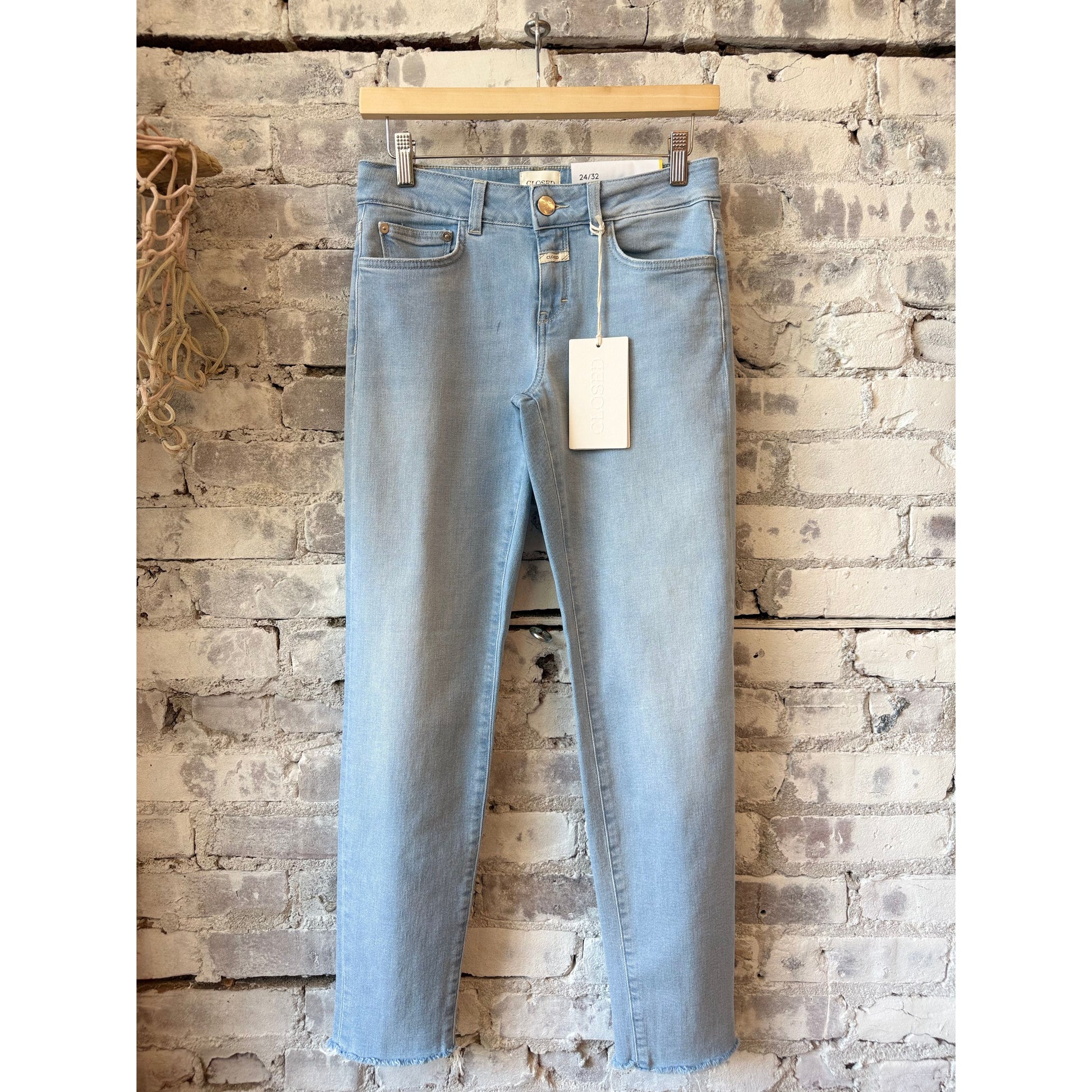 Women's Baker Slim Jean by Closed in light blue denim, showing a close-up of the fitted, slim-leg style with classic five-pocket design.