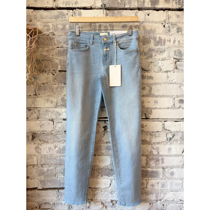 Women's Baker Slim Jean by Closed in light blue denim, showing a close-up of the fitted, slim-leg style with classic five-pocket design.