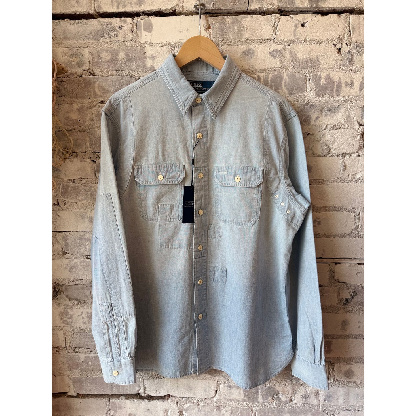 Men's Polo RL chambray compass workshirt in medium indigo, featuring a button-up design and casual workwear style.