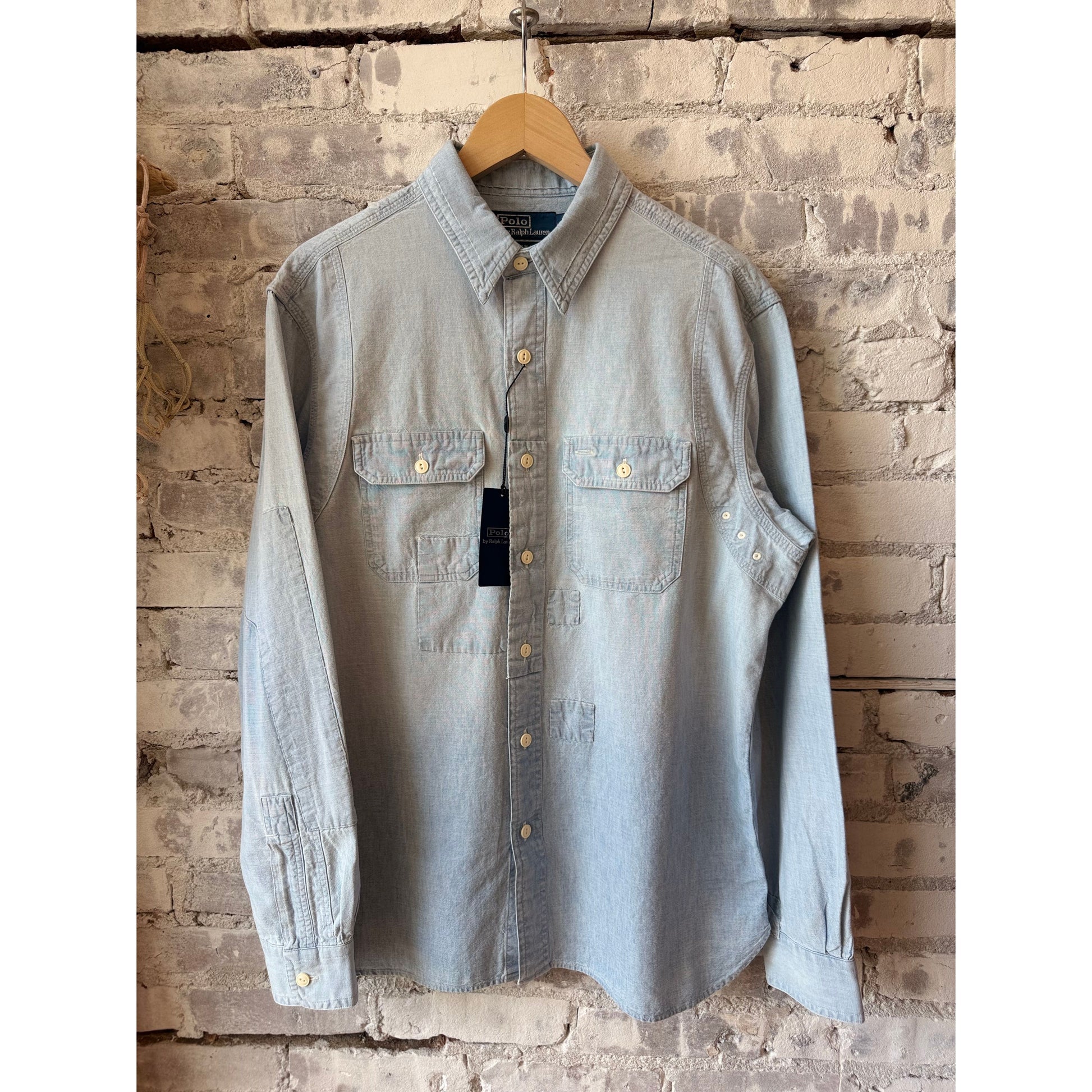 Men's Polo RL chambray compass workshirt in medium indigo, featuring a button-up design and casual workwear style.