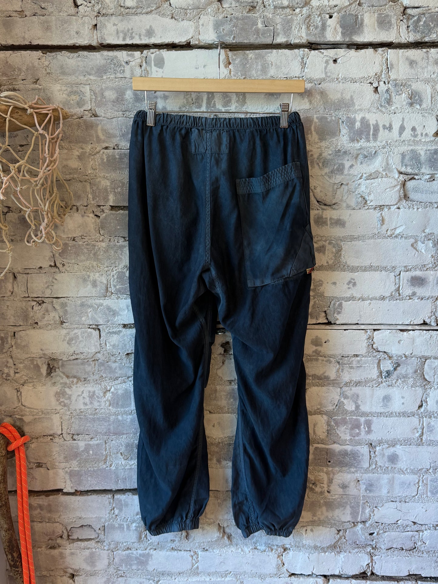 Women's Freecity Airjump Pant in matte satin with flap and snap details, featuring Moonshrooms pattern, relaxed fit and stylish design.