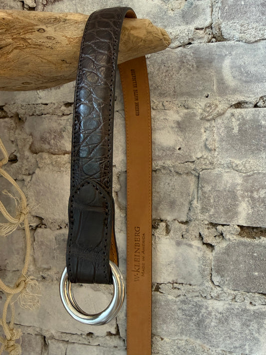 Men's 1-1/8" matte alligator leather O-ring belt in chocolate by W. Kleinberg, featuring a stylish alligator texture and O-ring buckle.