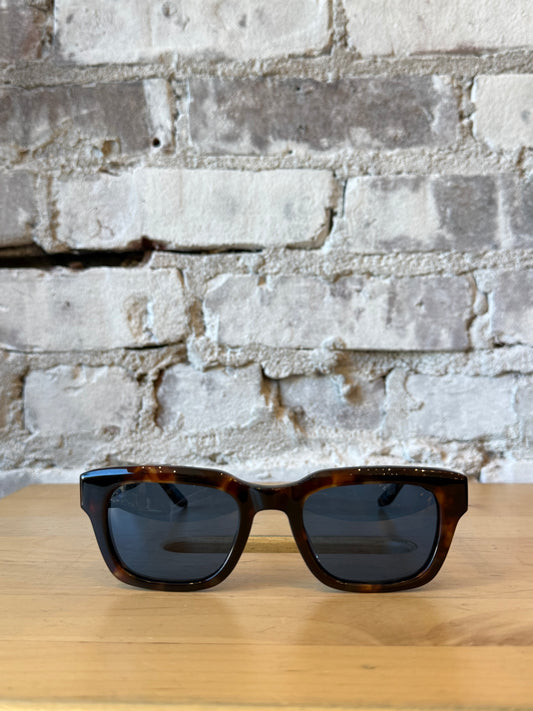 Men's Barton Perreira Butzi sunglasses with chestnut-colored frames and Eleos lenses, stylish and modern eyewear.