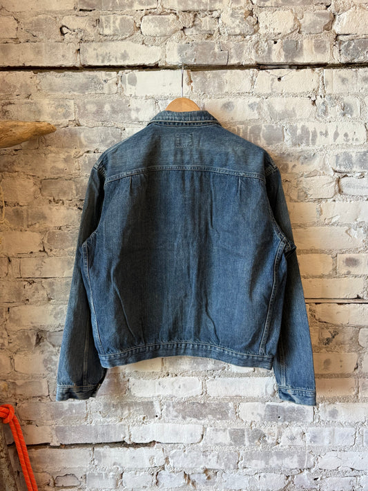 Unisex 12oz vintage light selvedge denim short jacket by Chimala, showcasing classic denim texture and casual fit.