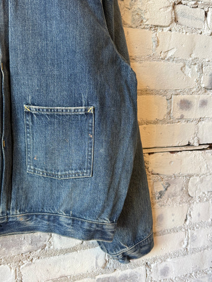 Unisex 12oz vintage light selvedge denim short jacket by Chimala, shown on a mannequin with rolled sleeves and classic fit.