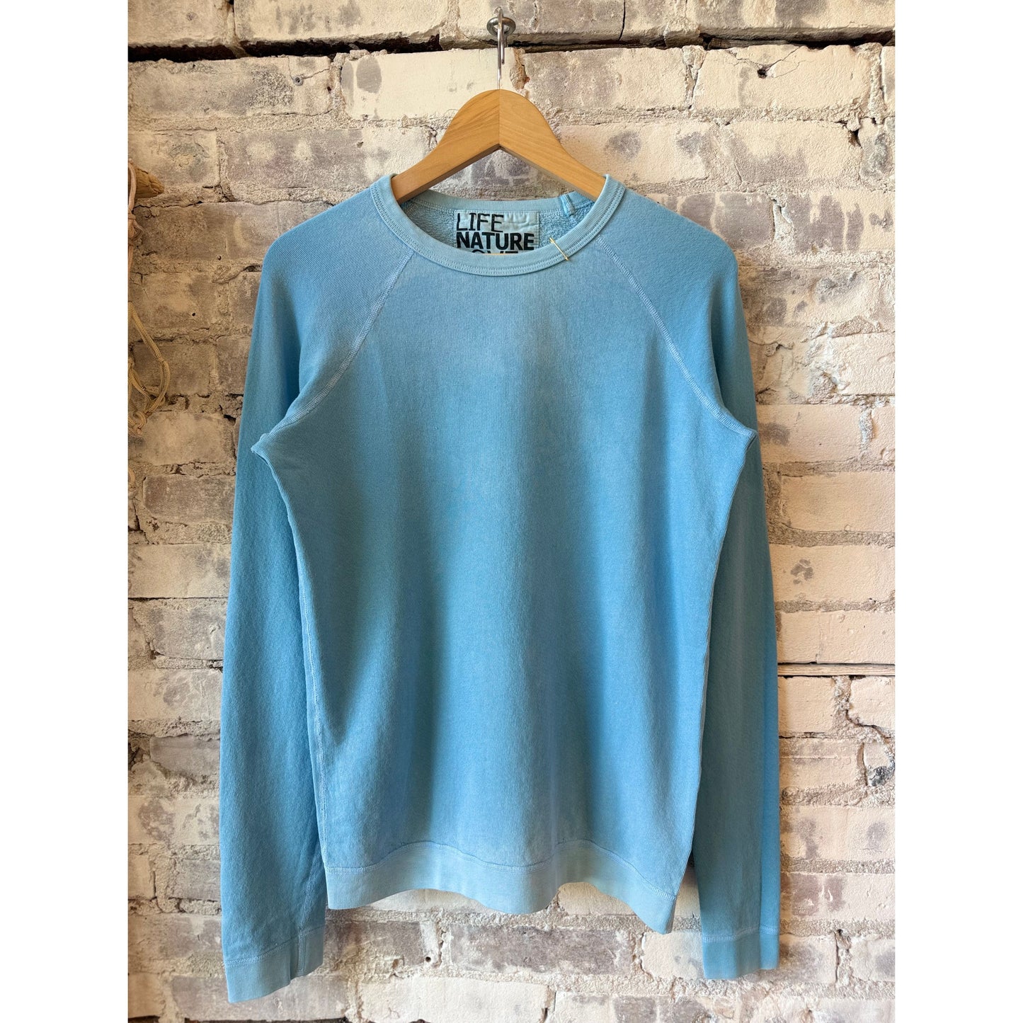 Women's blue fluffy rabbit sweatshirt by Freecity featuring a cute lucky rabbit design on the front.