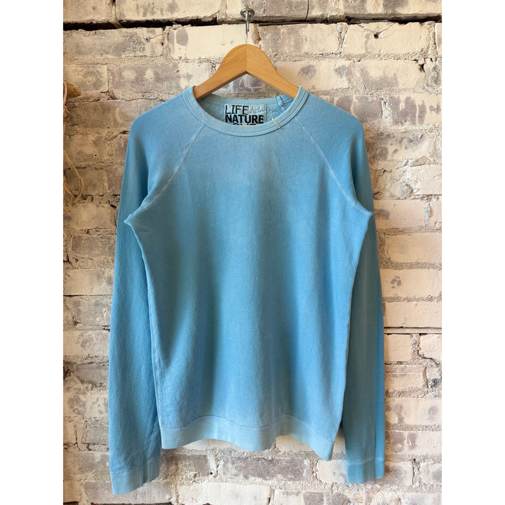 Women's blue fluffy rabbit sweatshirt by Freecity featuring a cute lucky rabbit design on the front.