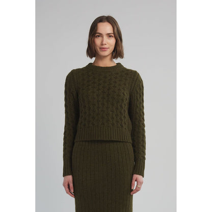 Women's Amara Sweater by ELEVEN SIX in dark olive, featuring a cozy knit fabric and a relaxed fit, shown on a model.