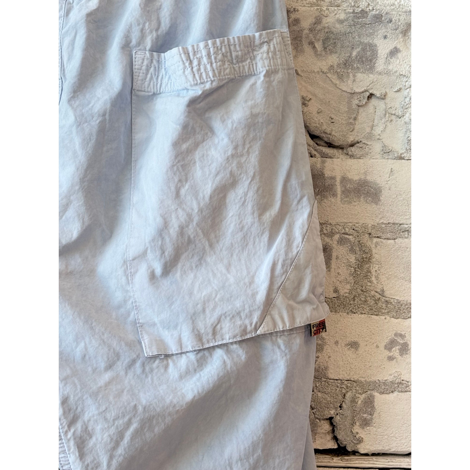 Women's Freecity OutOfSight Poplin Air Flap Snap Kite Pant in blue with tailored fit and functional air flap pockets.