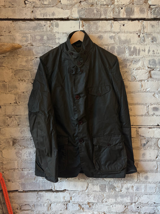 Men's Barbour Beacon Sports Waxed Jacket in olive, showing the durable waxed fabric, classic fit, and outdoor-ready style.