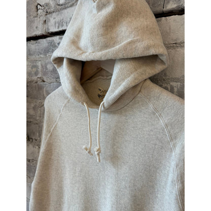 Men's Kepani Manchester 2 Pullover Hoodie in oatmeal, showing the soft fabric, hood, and front pocket design.