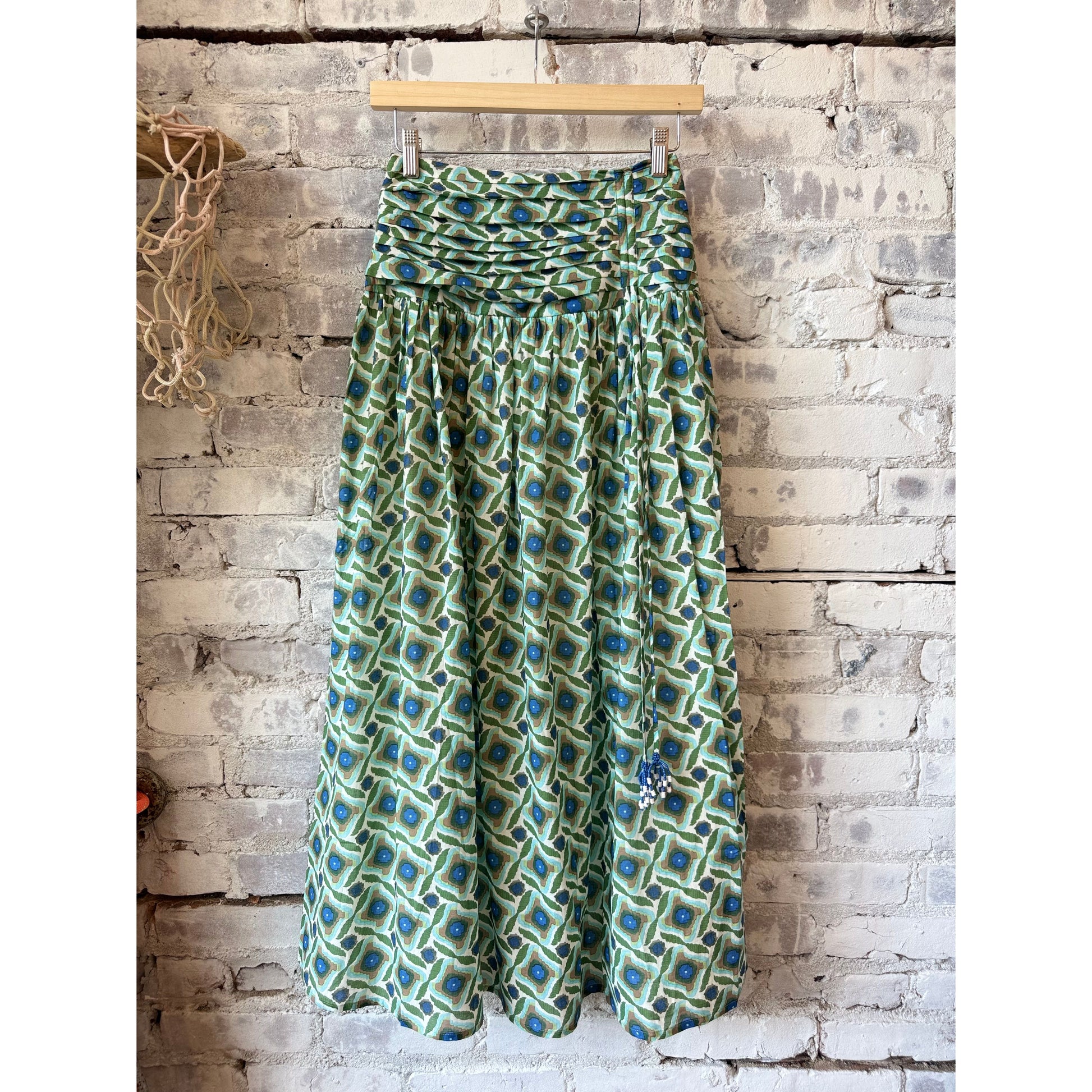 Exquise Eldon smocked waist zippered midi skirt for women in multi-colored fabric, showcasing a stylish, flowy design.