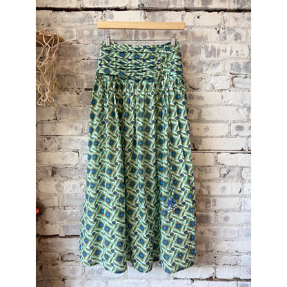 Exquise Eldon smocked waist zippered midi skirt for women in multi-colored fabric, showcasing a stylish, flowy design.