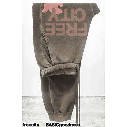 Women's Freecity large Sunfades pocket sweatpants in mud color, showing the relaxed fit and side pockets.