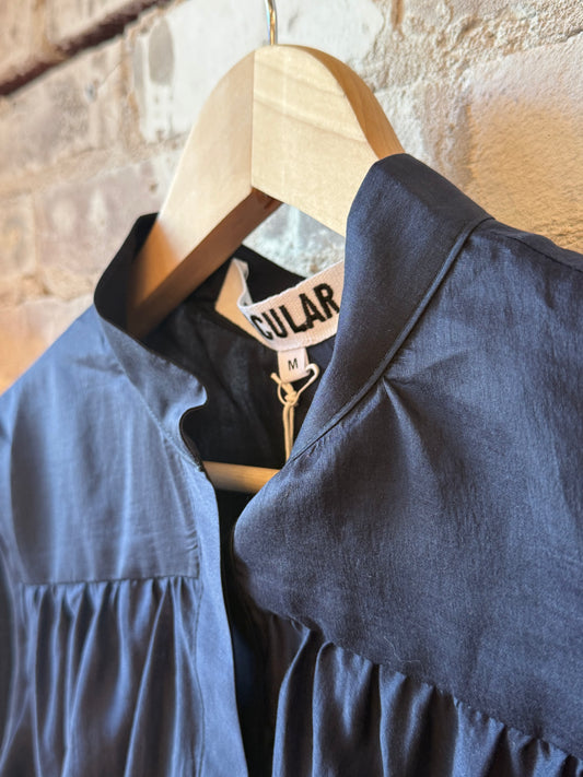 Navy women's Sutton shirt by Secular, featuring a classic button-up design with a collar and long sleeves.