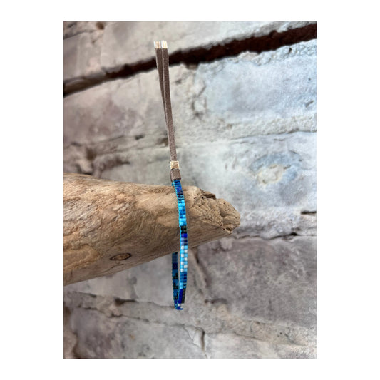 Blue mini bracelet by Julie Rofman, featuring delicate jewelry design with small beads on a fine chain.
