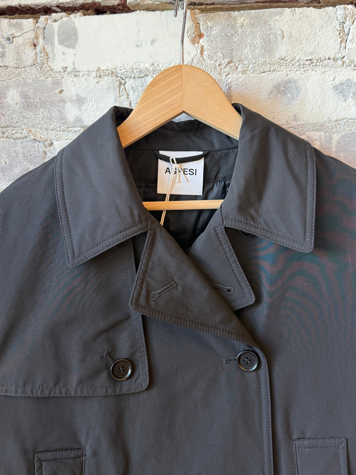Black women's Scarlett jacket by Aspesi, stylish outerwear with a sleek fit and modern design, shown on a model.