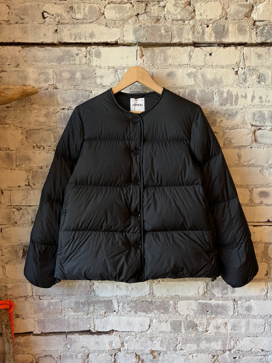 Women's black Brezza jacket by Aspesi, stylish outerwear with a sleek fit, shown on a model in a casual outdoor setting.