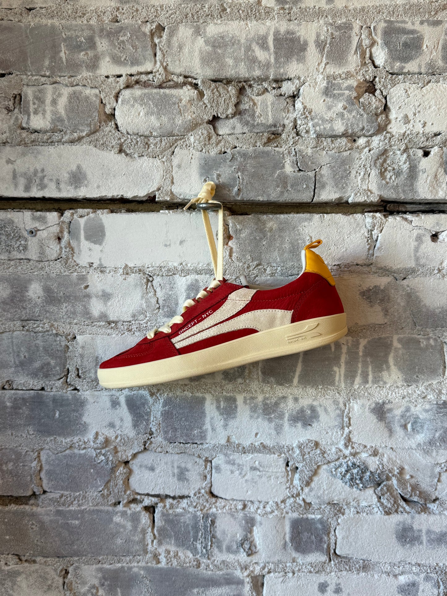 Women's Fez Sneaker by Oncept in retro red with white sole and stylish design, perfect for casual wear.