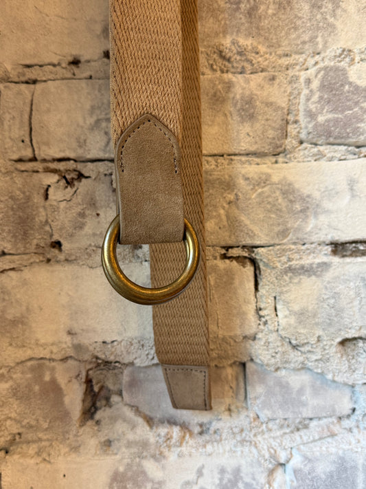 Khaki cotton weave O-ring belt with bison tabs from W. Kleinberg, showcasing the textured fabric and sturdy metal rings.