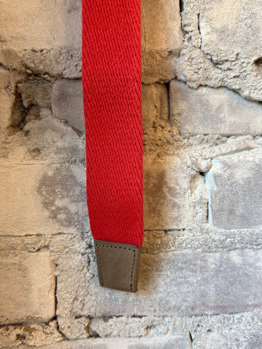 Red 1-3/8-inch cotton weave O-ring belt with bison tabs by W. Kleinberg, showcasing durable fabric and stylish design.