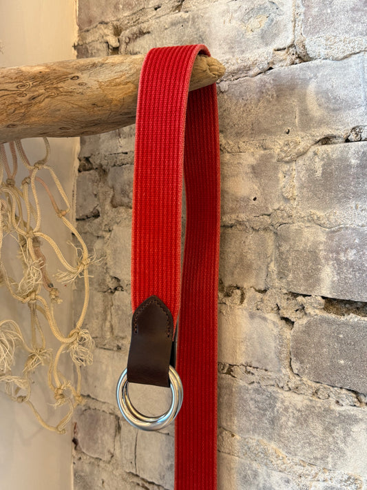 Men's red woven leather belt with striped pattern, O-ring closure, and Sicily calf tabs by W. Kleinberg.