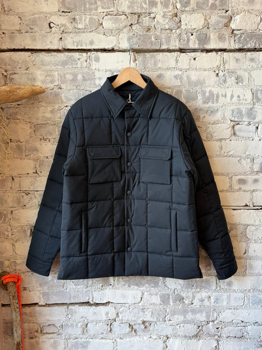 Men's navy padded quilted overshirt by Aspesi, featuring a padded design and quilted texture for warmth and style.