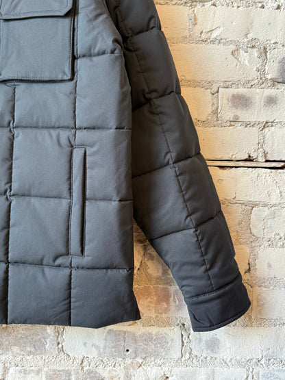 Men's navy padded quilted overshirt by Aspesi, featuring a padded, quilted design with a stand collar and front button closure.