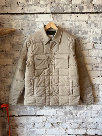 Men's padded quilted overshirt by Aspesi in colonial beige, showing the front view with quilted fabric and padded design.