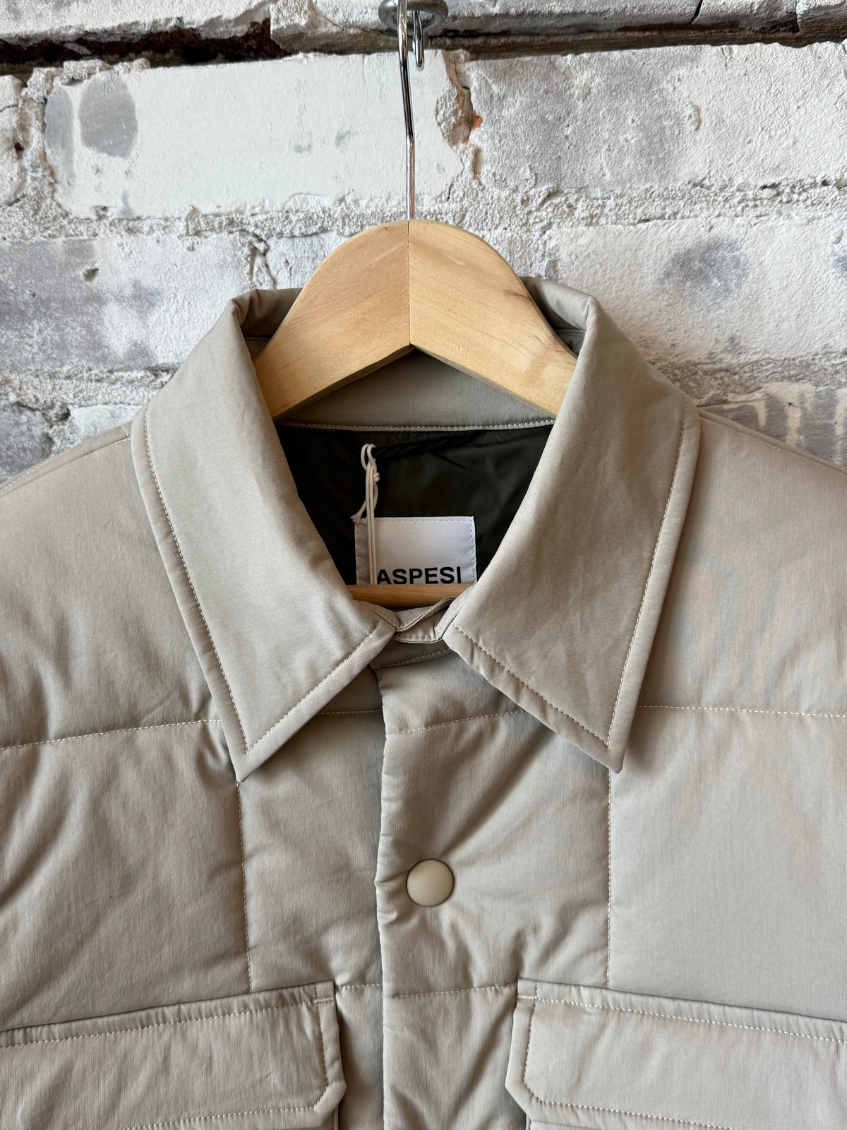 Men's padded quilted overshirt in colonial beige by Aspesi, featuring a comfortable, stylish design with a quilted texture.