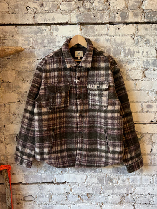 Men's brown Skip quilted plush plaid shirt jacket by Surfside Supply, featuring a cozy quilted design and classic plaid pattern.