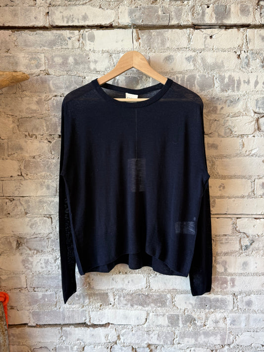 Close-up of a women's dark navy pure wool fine knit sweater by Closed Women's, showing soft textured fabric and fine stitching.