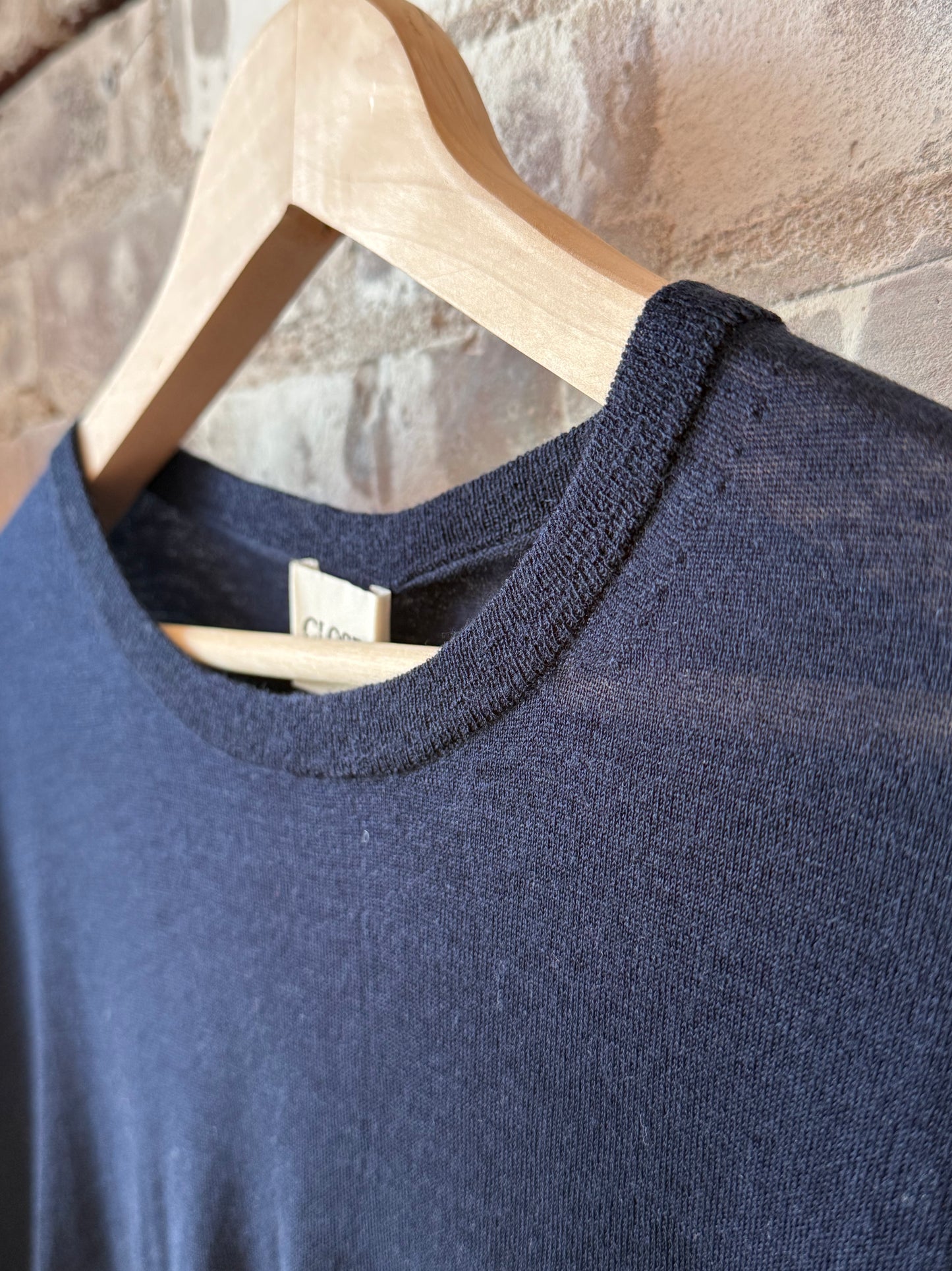 Women's dark night pure wool fine knit sweater by Closed Women's, close-up showing soft fabric and detailed stitching.