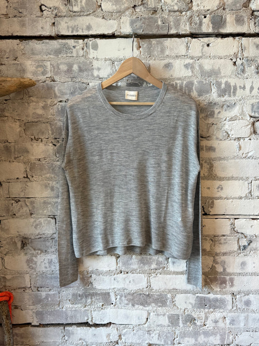 Close-up of a women's light grey melange pure wool fine knit sweater by Closed Women's, showing the soft, textured fabric.