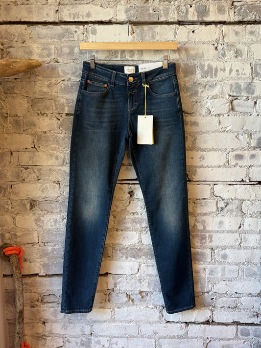 Closed Women's Baker Power Stretch Skinny Jean in dark blue, slim fit women's jeans with stretch fabric and classic five-pocket design.