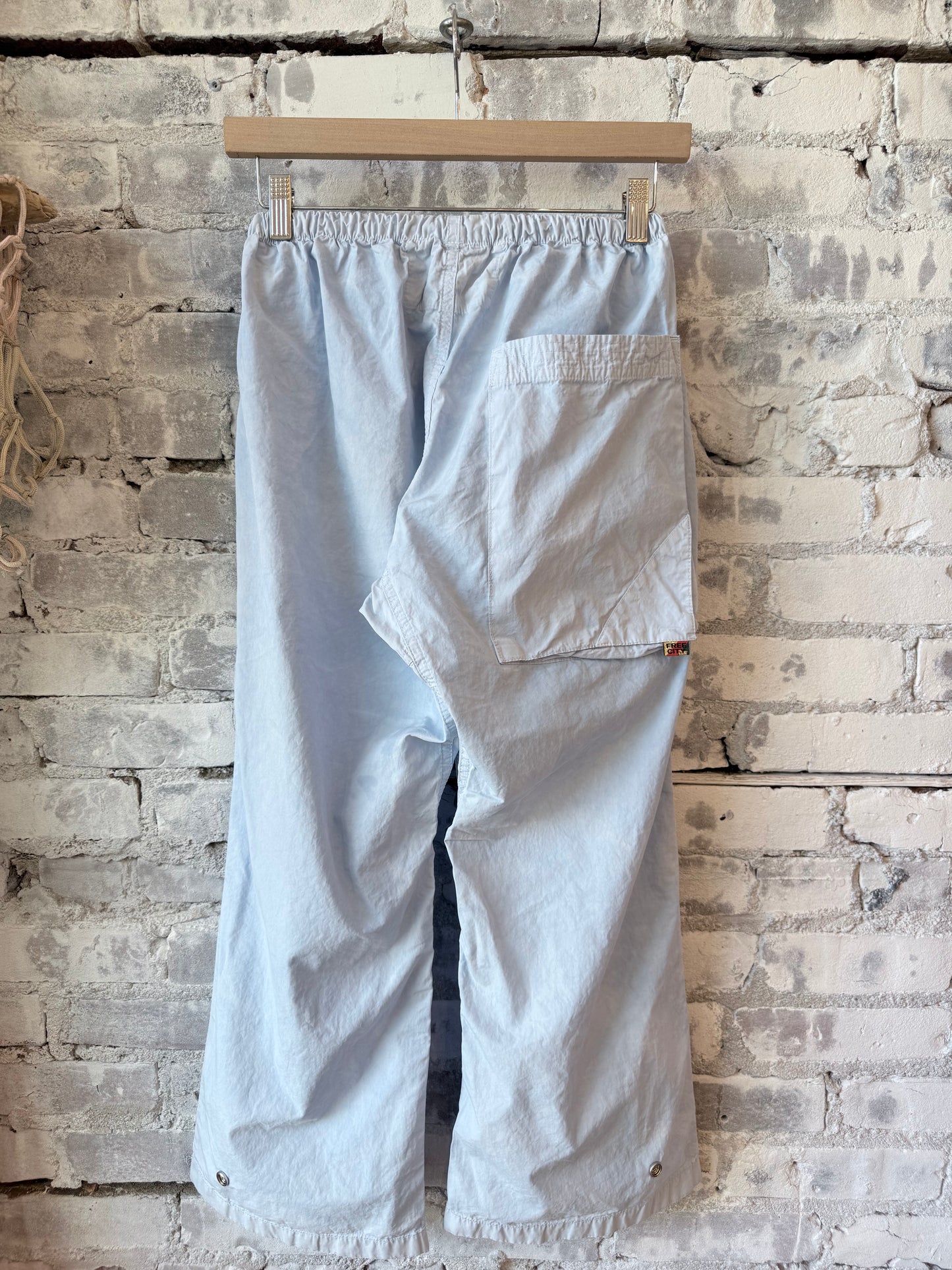 Women's blue Plant Out of Sight Poplin Air Flapsnap Kite Pant by Freecity, showing relaxed fit and stylish design.