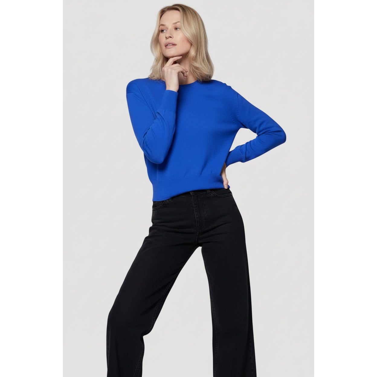 Women's organic cotton knit long-sleeve crewneck sweater in marine from Majestic Filatures, displayed sitting.