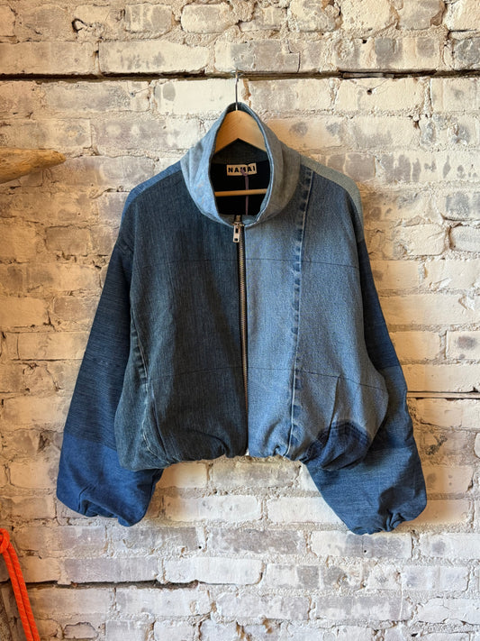 Women's Shira Denim Puffer Bomber Jacket by Namai in assorted washes, featuring a quilted design and casual streetwear style.