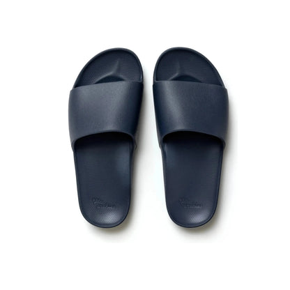 Navy Archies M8/W9 footwear with a birds-eye pattern, showcasing stylish casual shoes for men and women.