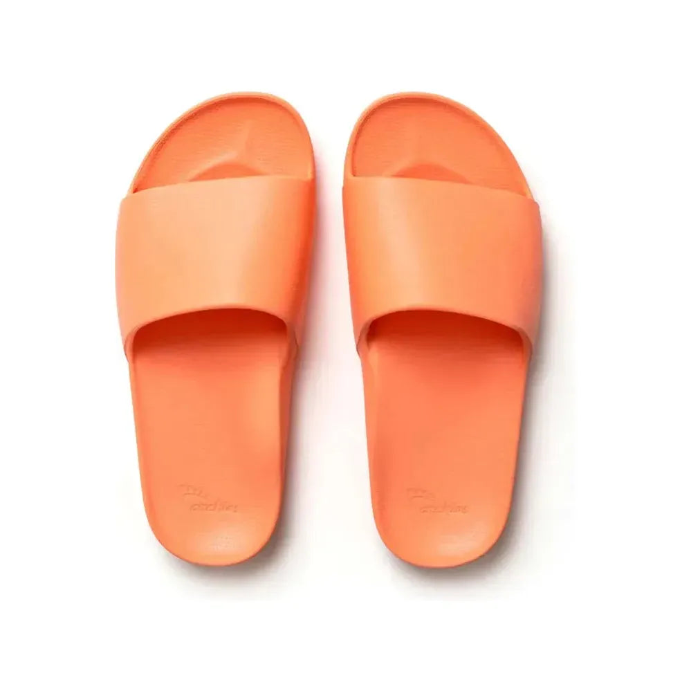 Peach-colored Archies M8/W9 footwear slides with open toe design and cushioned sole, casual slip-on style for comfortable wear.