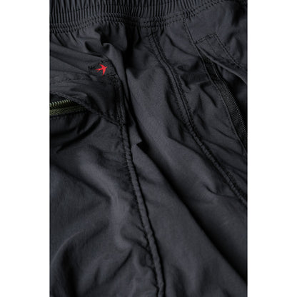 Men's Off-Trail Windpant by Relwen in black fade, showing lightweight, wind-resistant fabric and relaxed fit for outdoor activity.