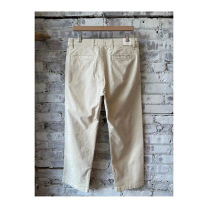 Men's NN07 Aden regular fit ivory chino pants displayed on a hanger, showcasing the clean design and tailored fit.