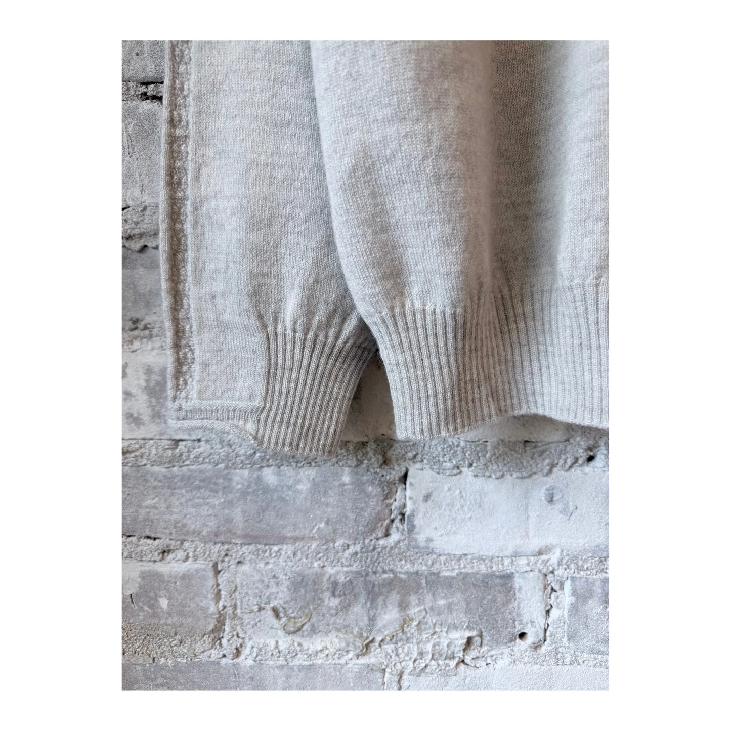 Light gray women's Airy Wool crewneck sweater by Pas De Calais, showing the soft, cozy knit fabric and classic fit.