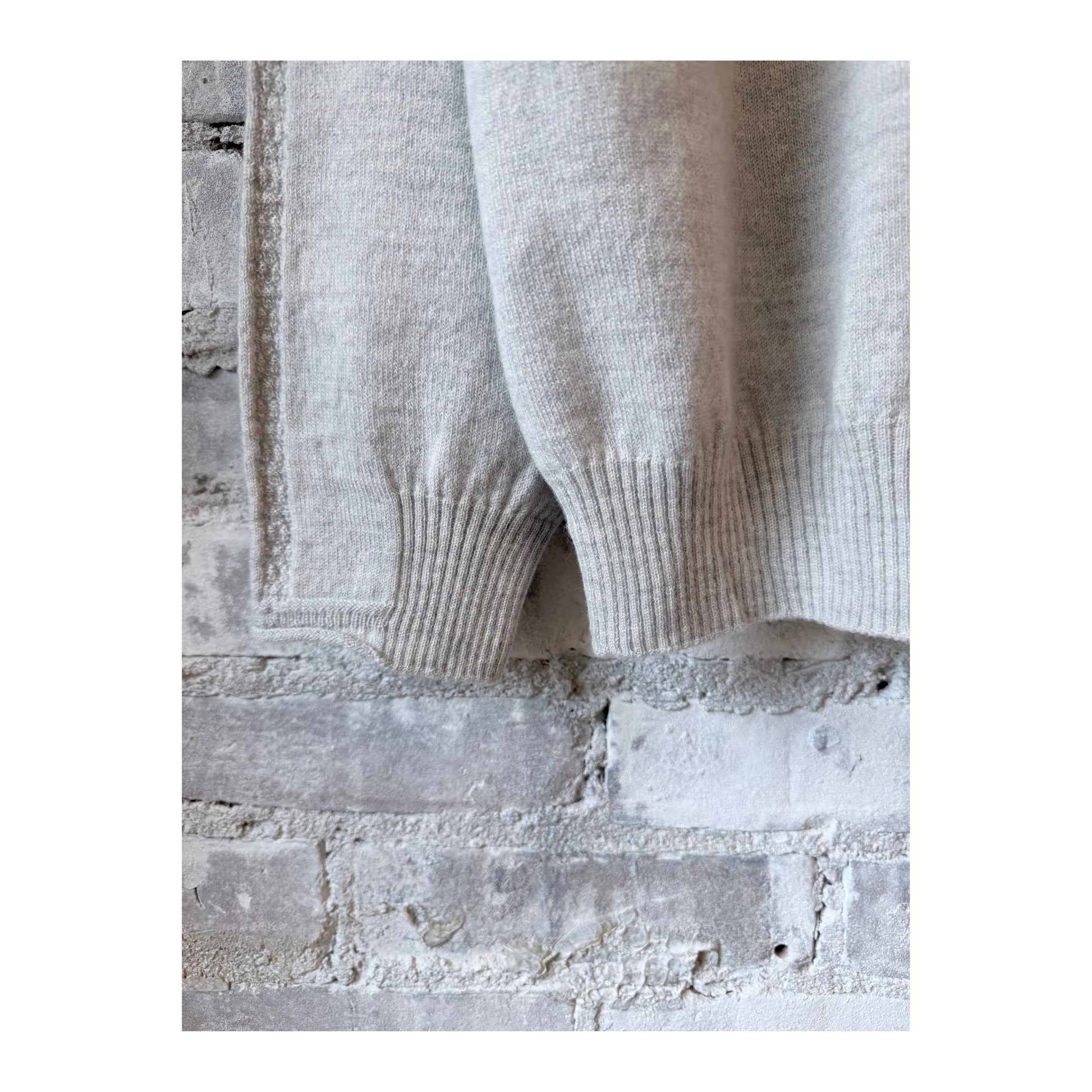 Light gray women's Airy Wool crewneck sweater by Pas De Calais, showing the soft, cozy knit fabric and classic fit.