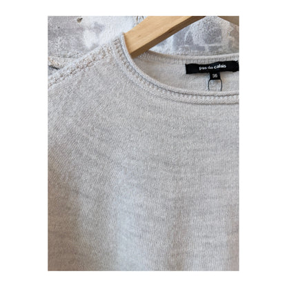 Light gray women's airy wool crewneck sweater by Pas De Calais, shown on a model, highlighting its soft knit texture.